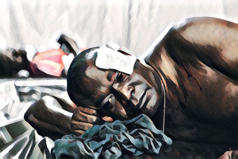 救急病院で治療を受ける患者 Ⓒ MSF